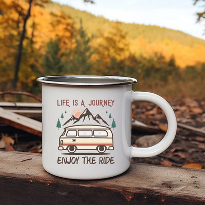 a camper mug sitting on top of a wooden table