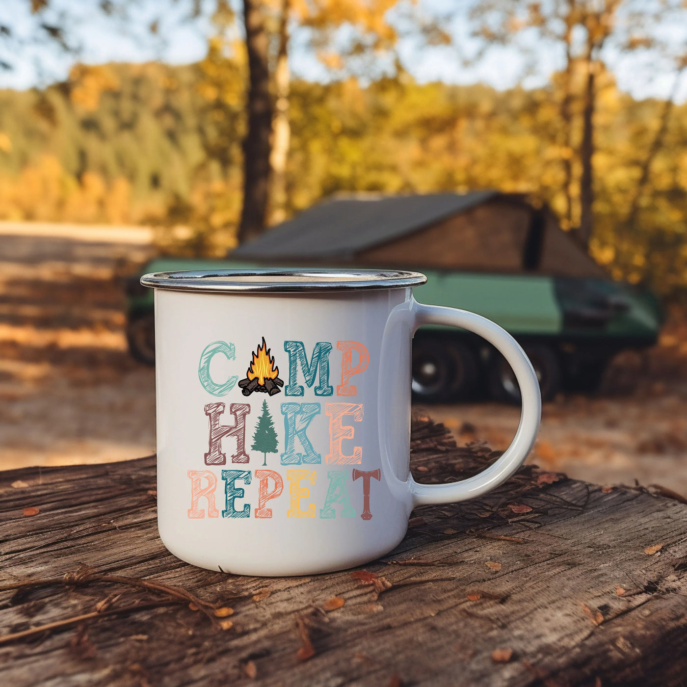 a camp coffee mug sitting on top of a tree stump