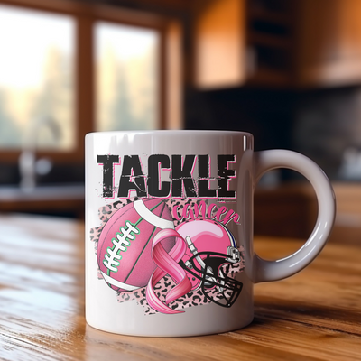 a white coffee mug with a pink ribbon on it