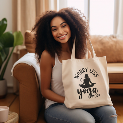 a woman sitting on a couch holding a yoga bag