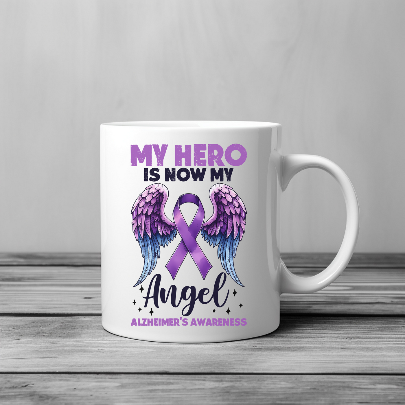 a white coffee mug with a purple ribbon and angel wings