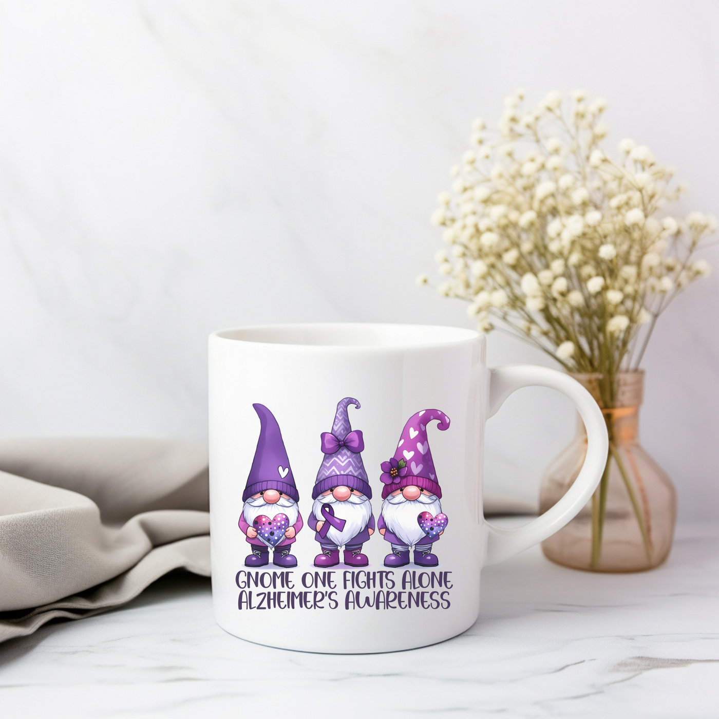 a white coffee mug with three gnomes on it