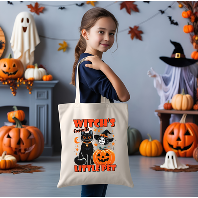 a little girl holding a trick or treat bag