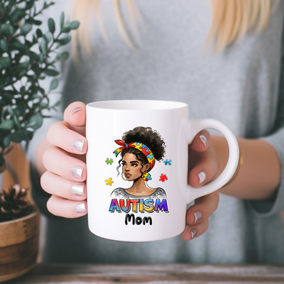 a woman holding a coffee mug with an image of a woman's face on