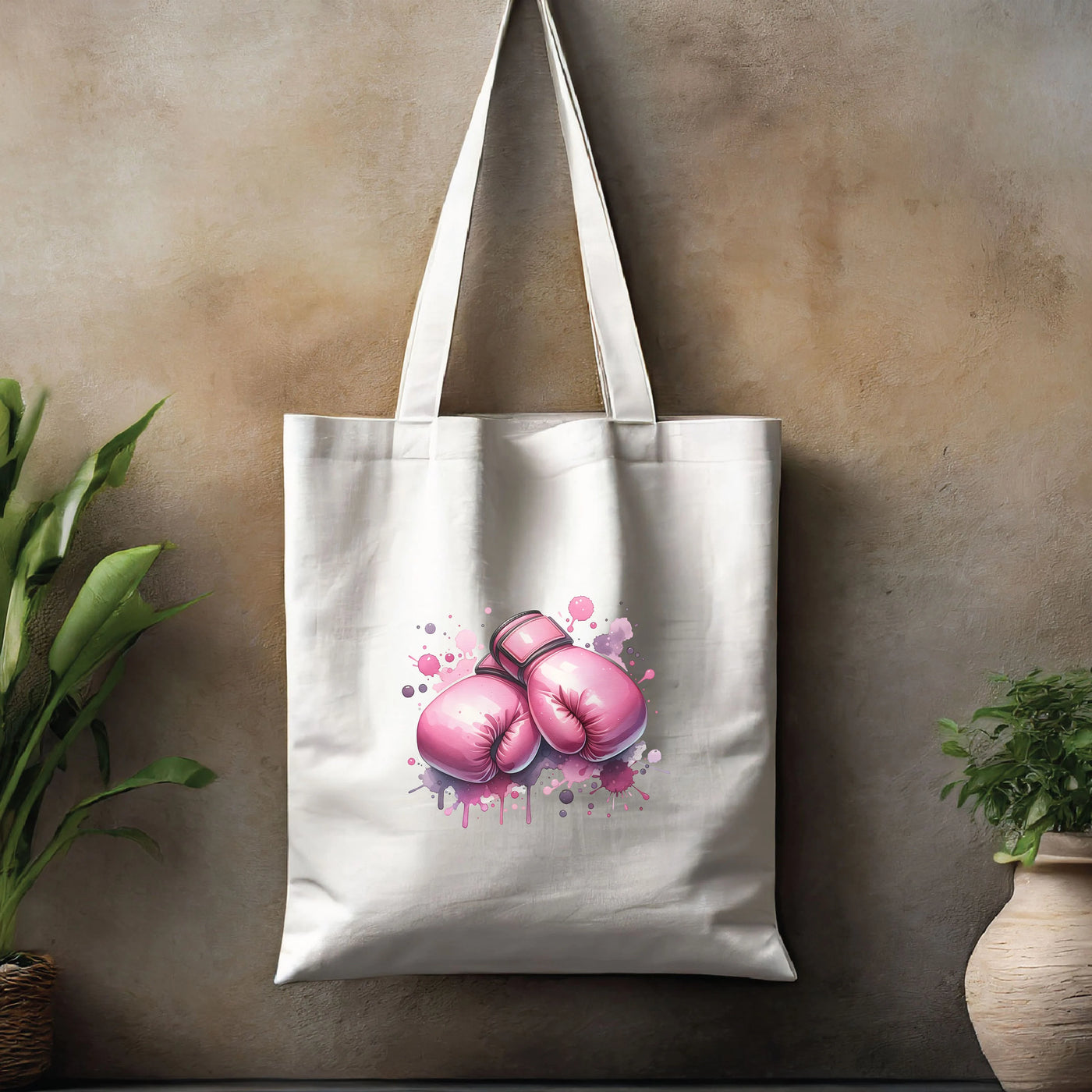 a white tote bag with pink boxing gloves on it