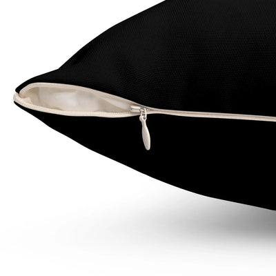 a black pillow with a white zipper on it