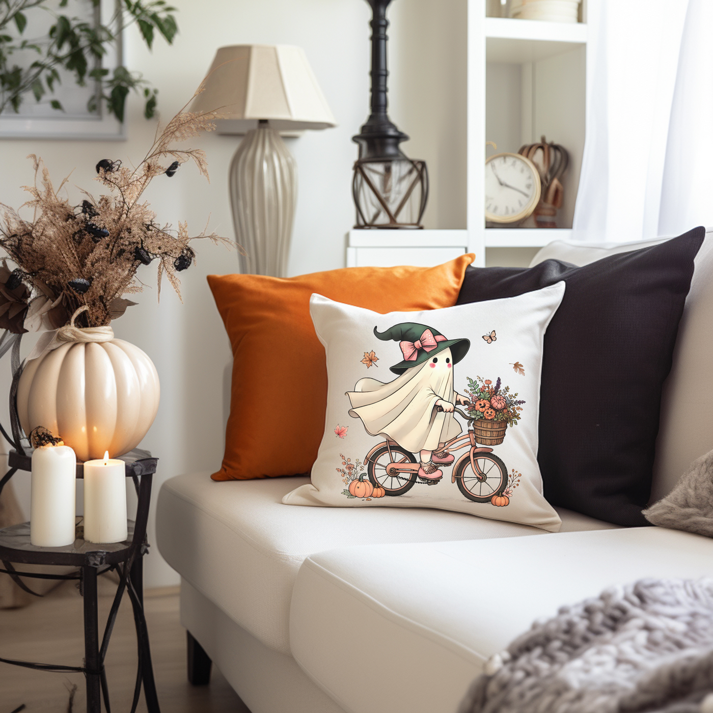 a living room with a white couch and pillows