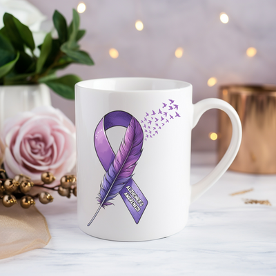 a coffee mug with a purple ribbon on it