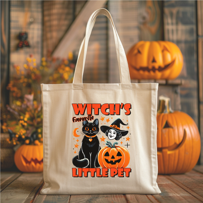 a white tote bag with a black cat and a ghost on it