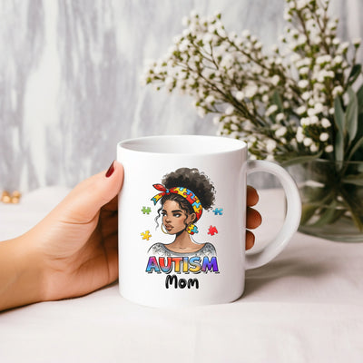 a woman holding a coffee mug with an image of a woman on it