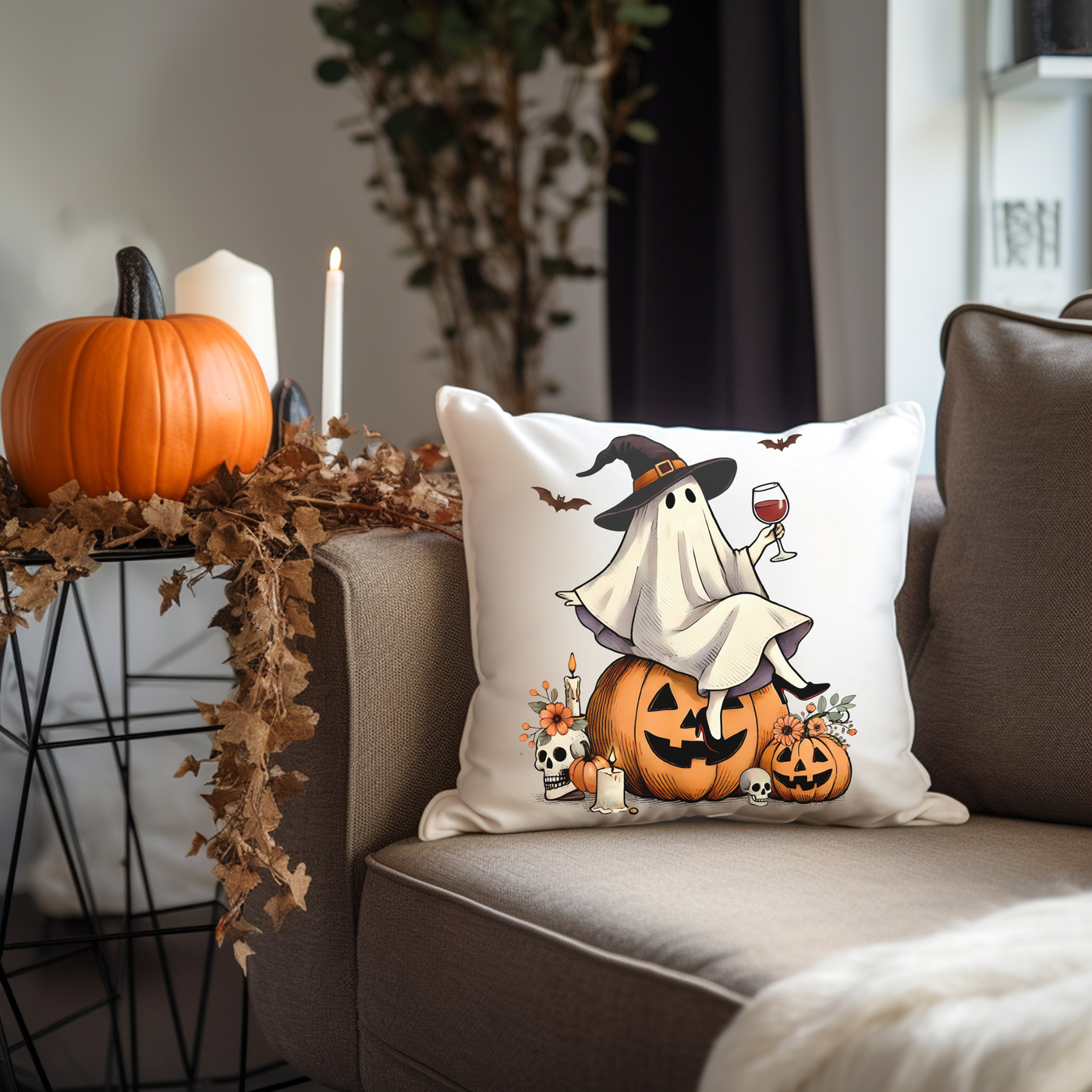 a couch with a halloween pillow on it