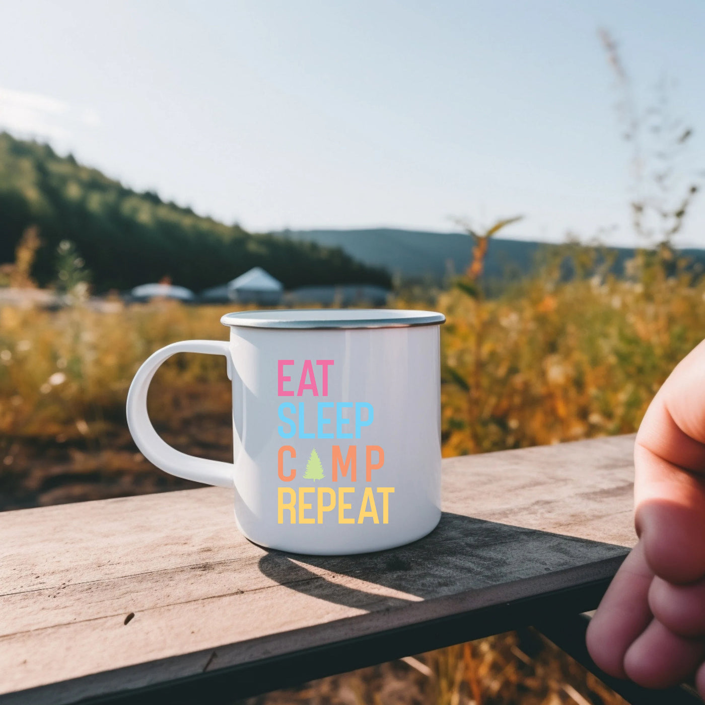 a person holding a coffee mug with the words eat sleep camp repeat on it