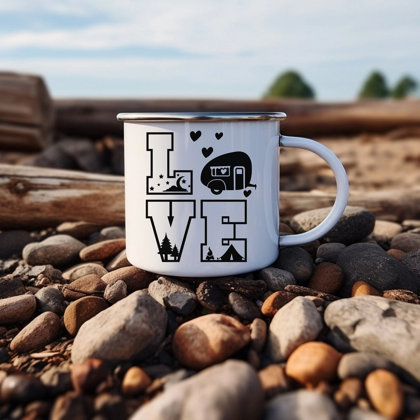 a camper mug sitting on top of a pile of rocks