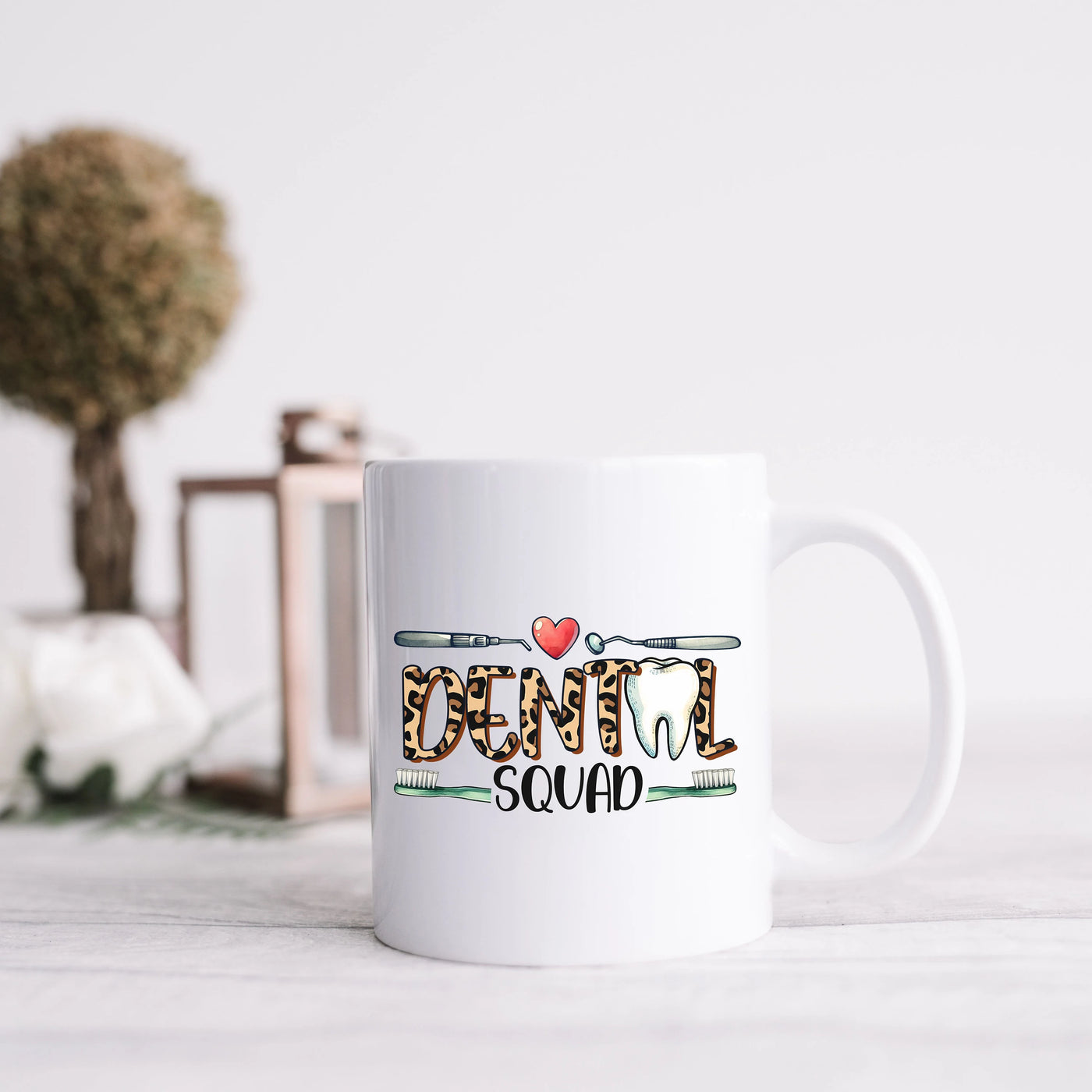 a white coffee mug sitting on top of a table