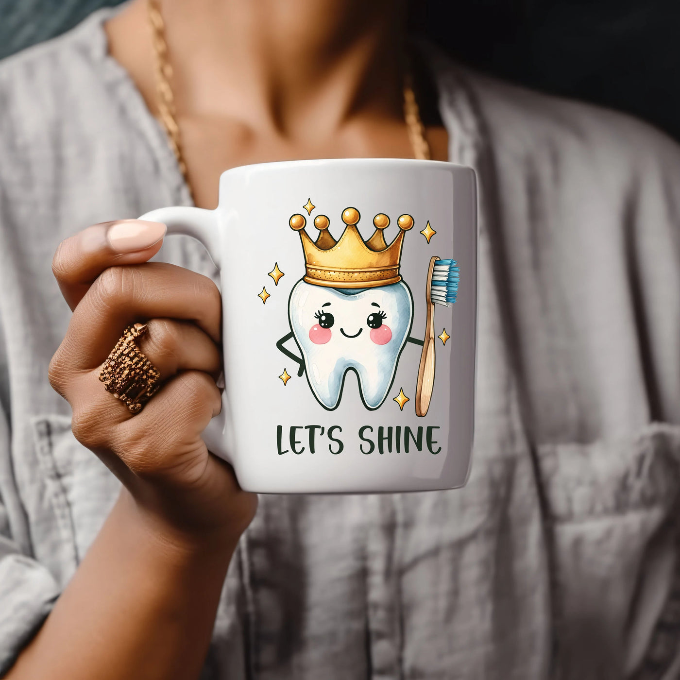 a woman holding a coffee mug with a toothbrush on it