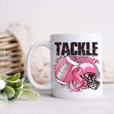 a white coffee mug with a pink football design