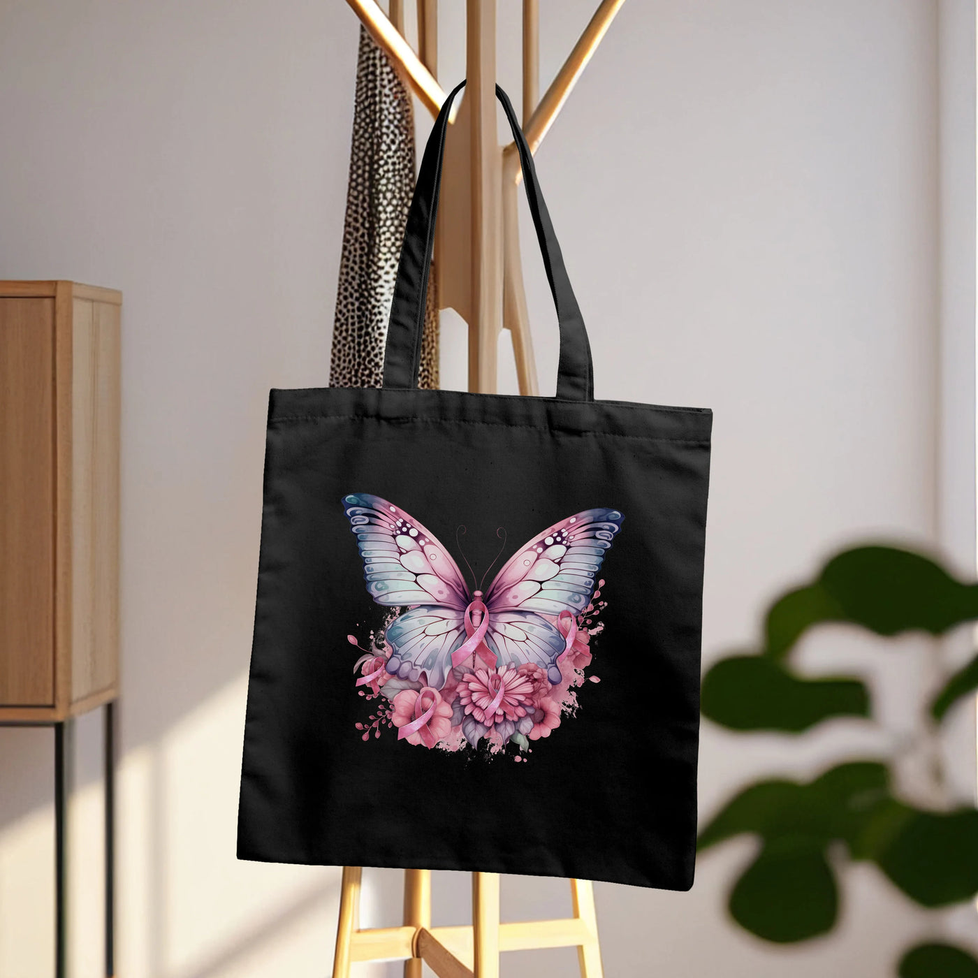 a black bag with a pink butterfly on it