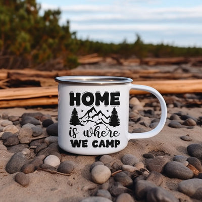 a camp mug sitting on top of a pile of rocks