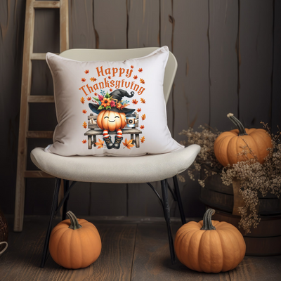 a white chair with a happy thanksgiving pillow on it