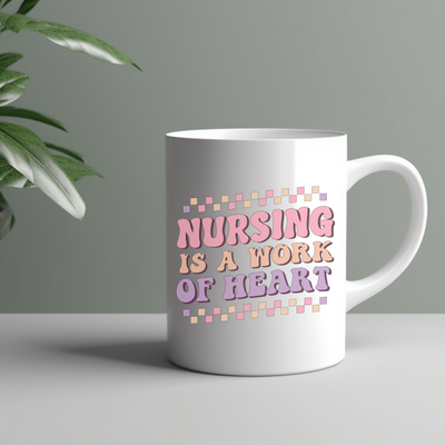 a white coffee mug with the words nursing is a work of heart