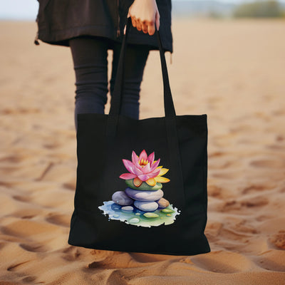 a woman carrying a black bag with a picture of a flower on it