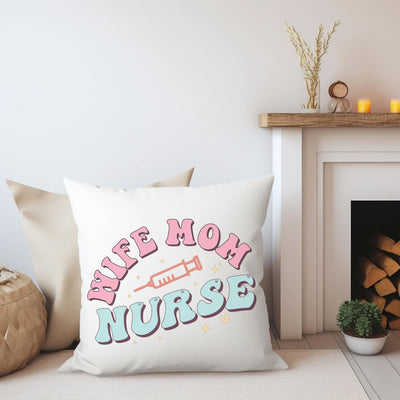 a pillow that says live mom nurse next to a fireplace