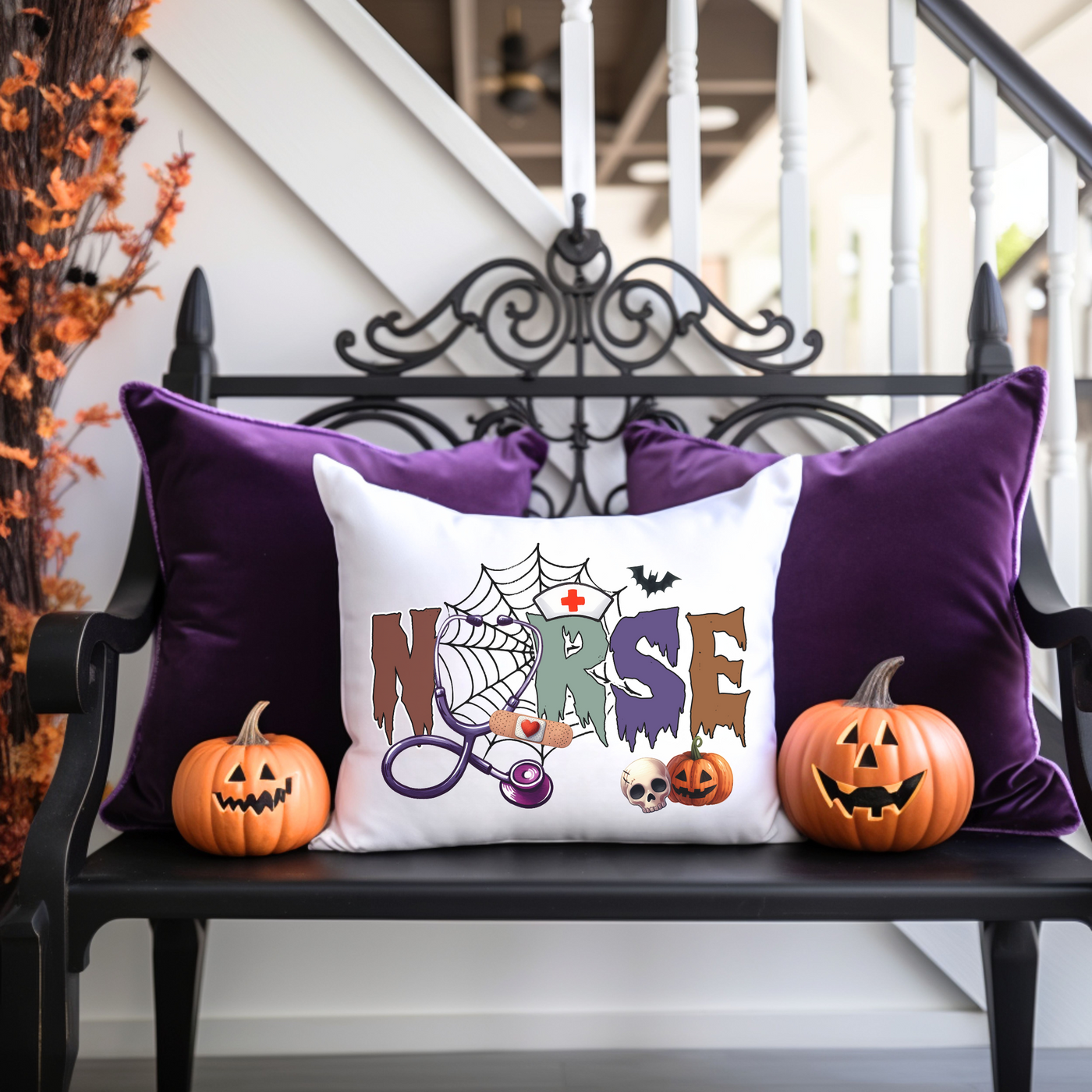 a bench with two pumpkins and a pillow on it