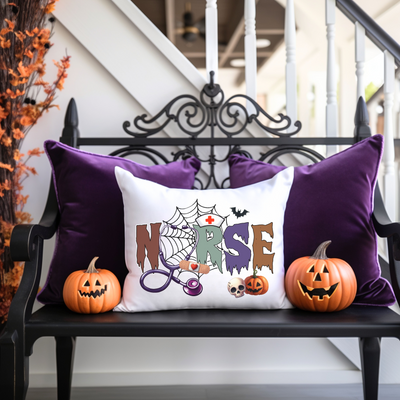 a bench with two pumpkins and a pillow on it