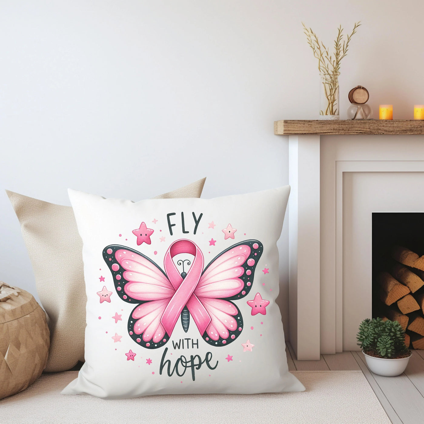 a pillow with a pink ribbon on it next to a fireplace