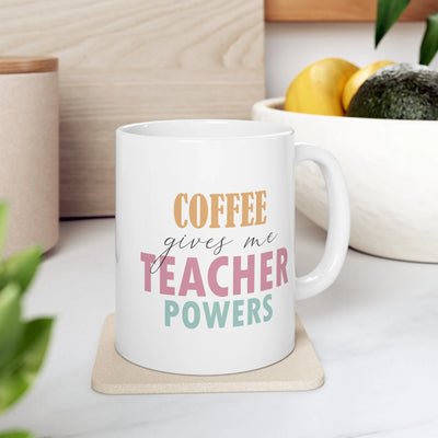 a coffee mug sitting on a coaster next to a bowl of fruit