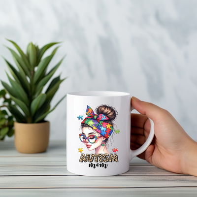 a person holding a coffee mug with a picture of a woman on it