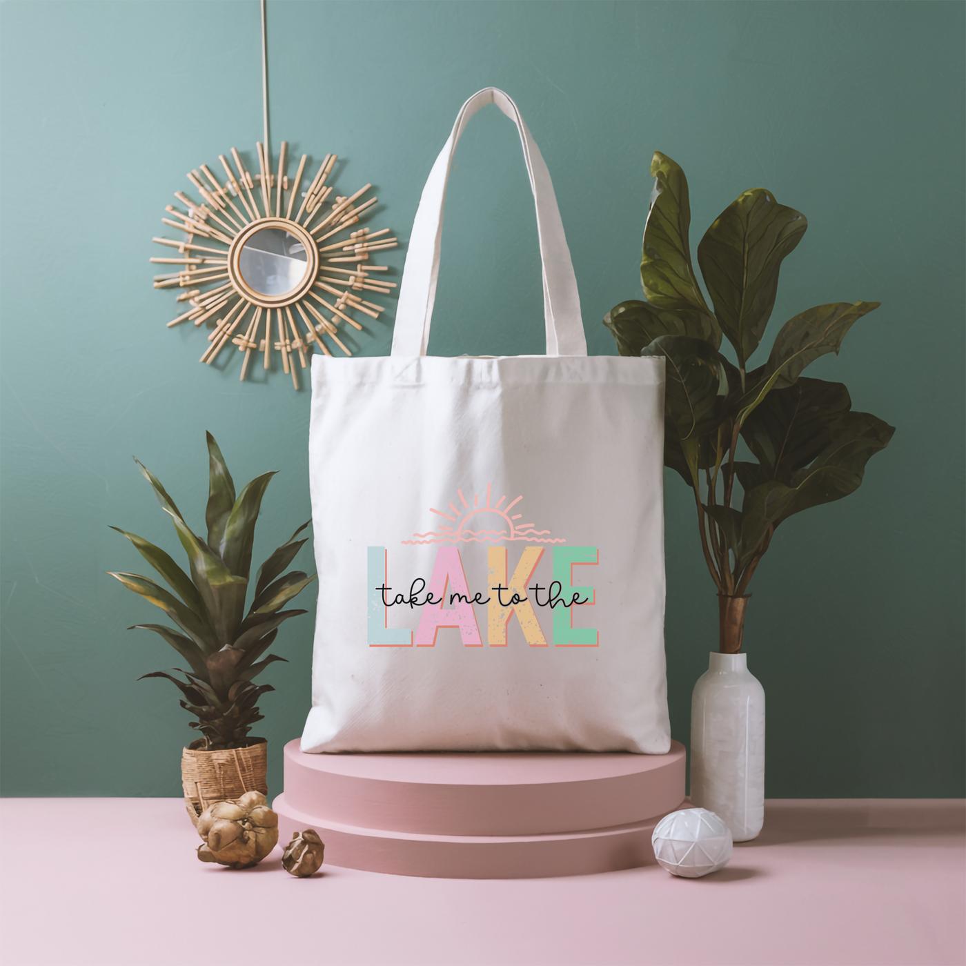 a white tote bag sitting on top of a pink table