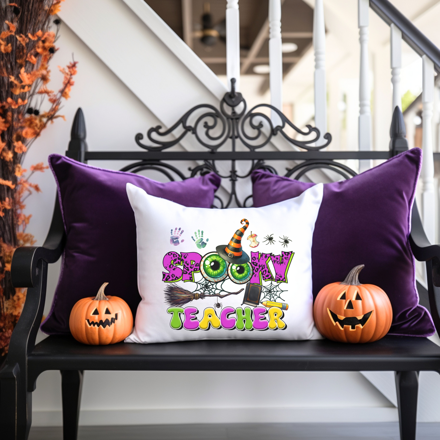 a bench with two pumpkins and a pillow on it