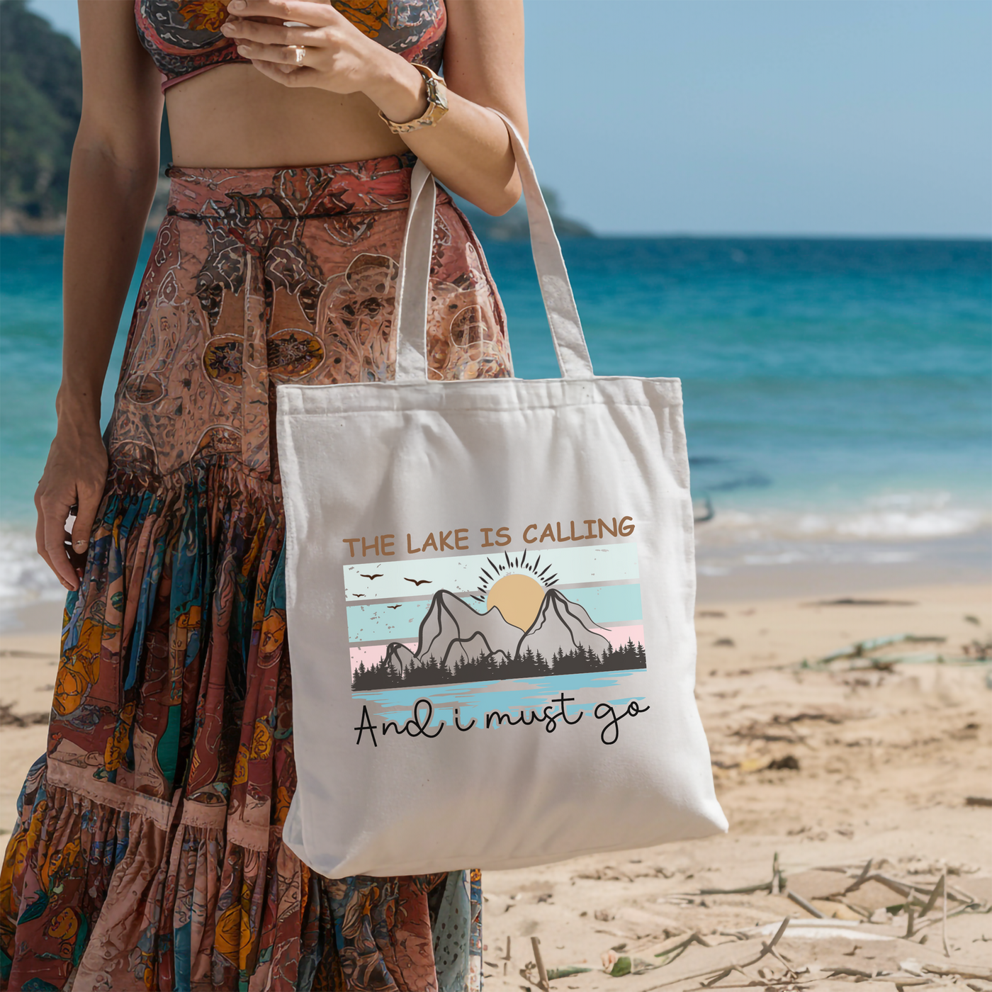 a woman standing on a beach holding a bag