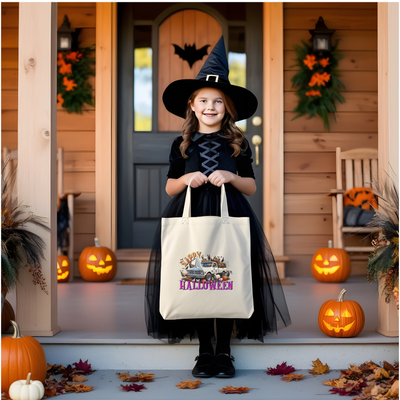 a little girl in a witch costume holding a trick or treat bag