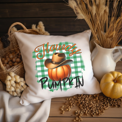 a pillow that has a picture of a pumpkin on it