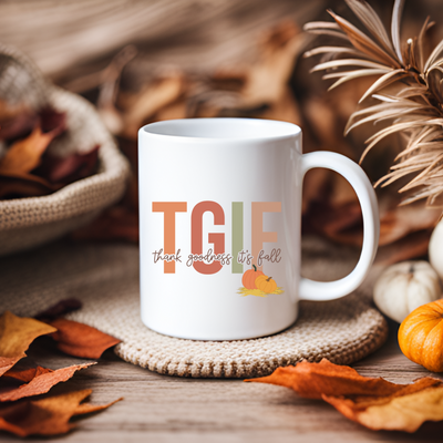 a white coffee mug sitting on top of a table