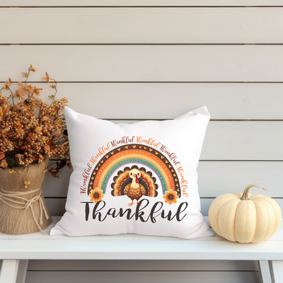 a white pillow sitting on top of a white bench