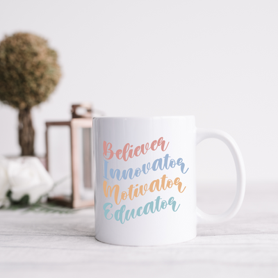 a white coffee mug sitting on top of a table