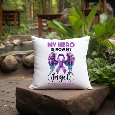 a white pillow with a purple ribbon on it