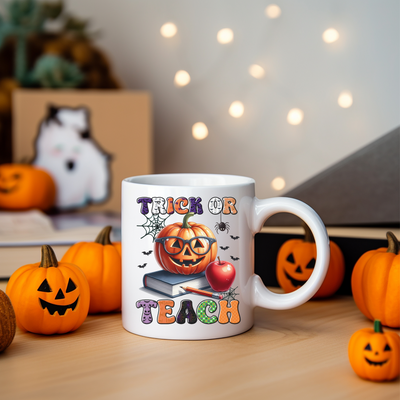 a white coffee mug with a trick or treat on it