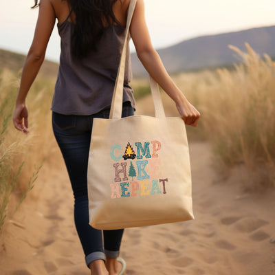 a woman walking down a dirt road carrying a bag