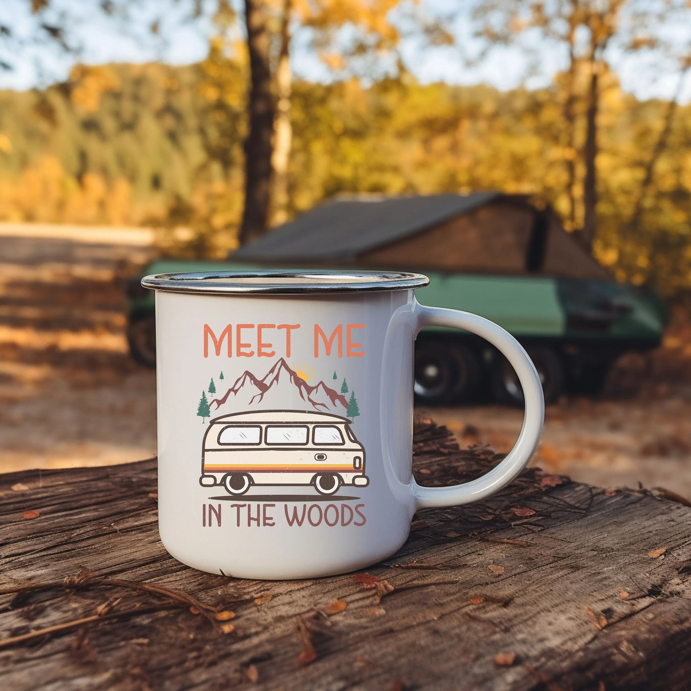 a camper mug sitting on top of a tree stump