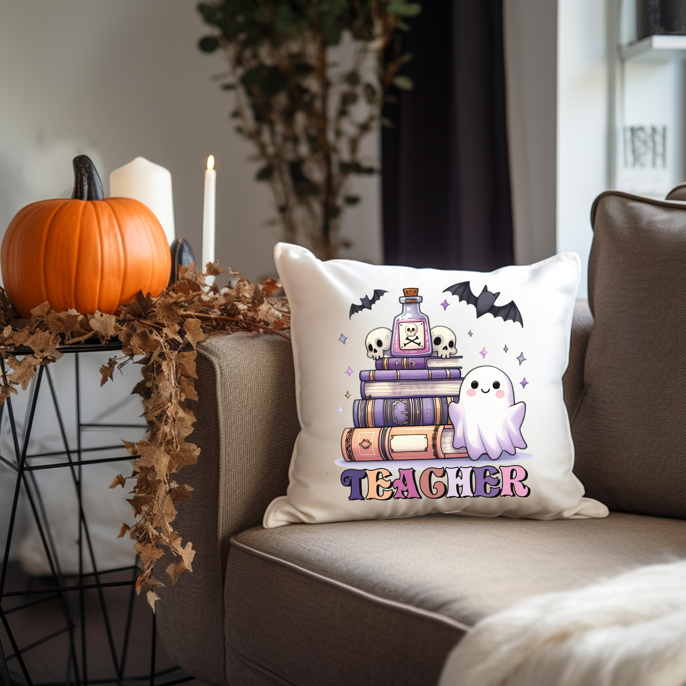 a pillow with a ghost on it sitting on a couch