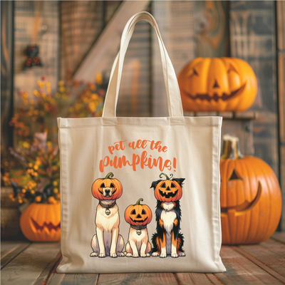 a trick or treat bag with three dogs and pumpkins