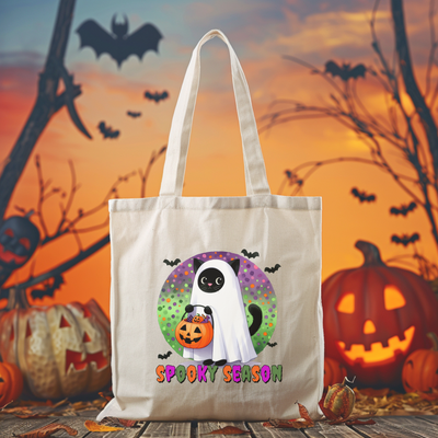 a trick or treat bag with a ghost holding a pumpkin