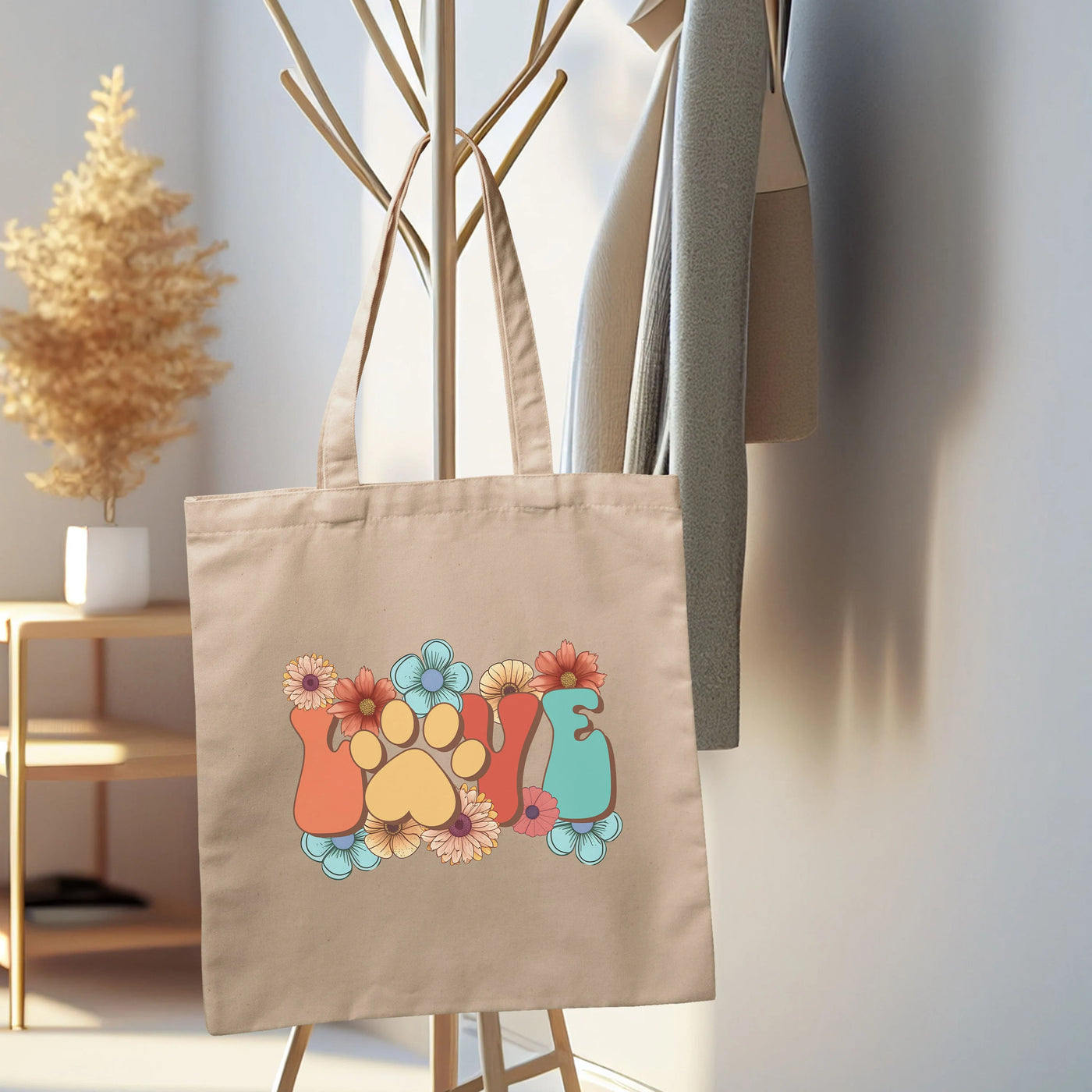 a tote bag hanging on a coat rack