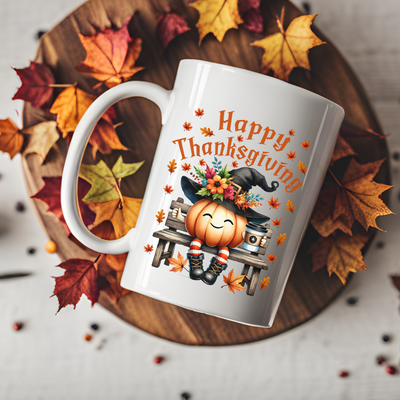 a white coffee mug with a happy thanksgiving design on it