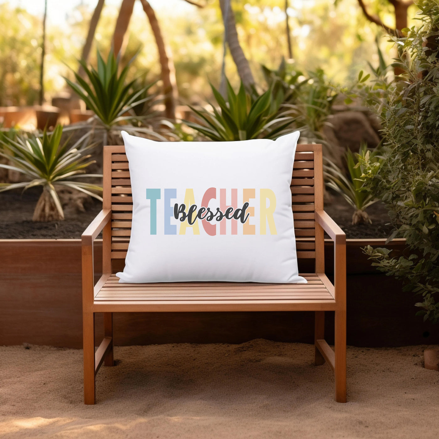 a white pillow sitting on top of a wooden chair