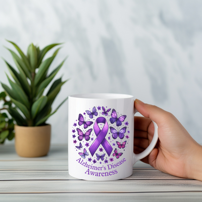 a person holding a coffee mug with a purple ribbon on it